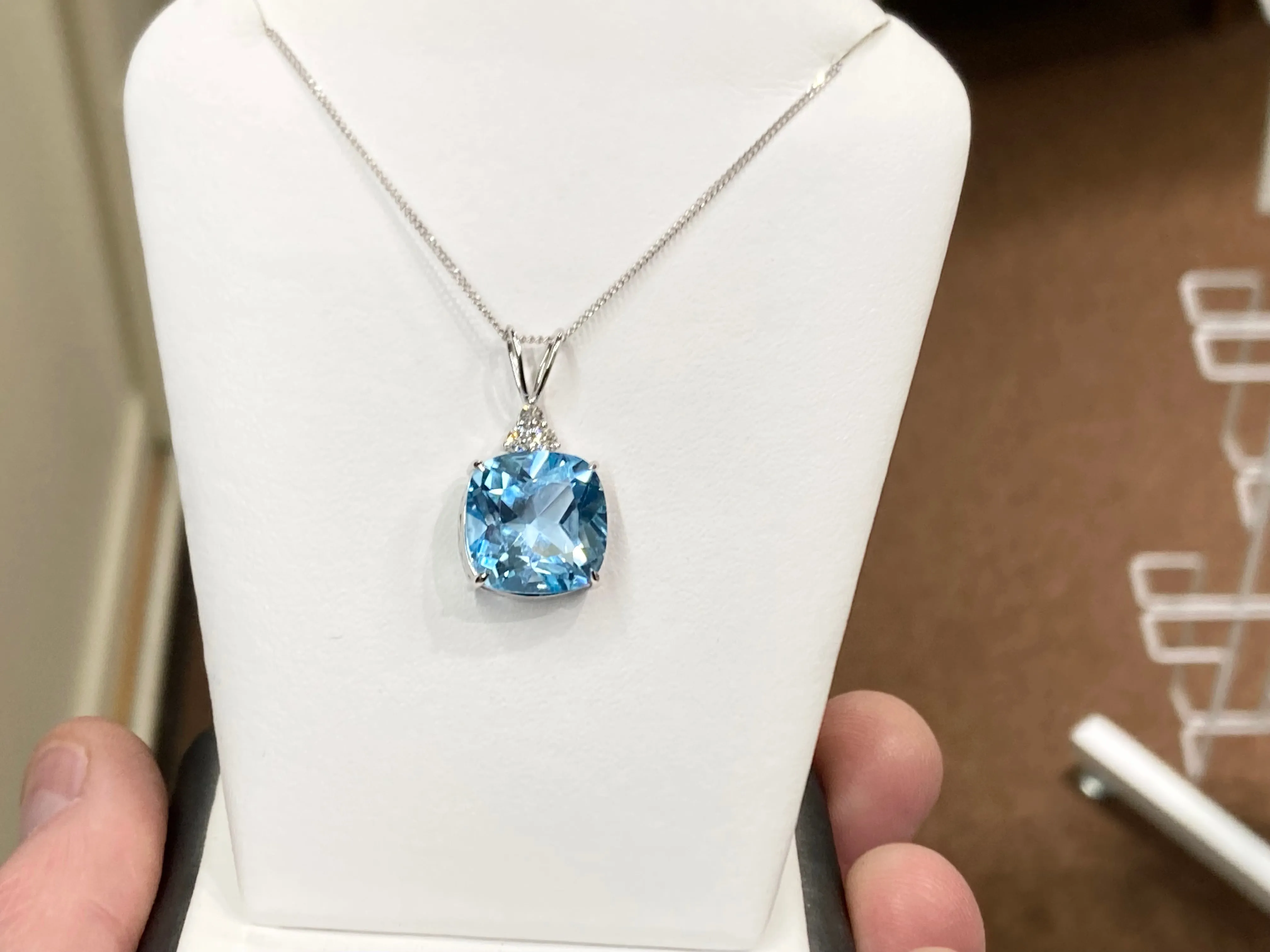 Blue Topaz And Diamond White Gold Pendant