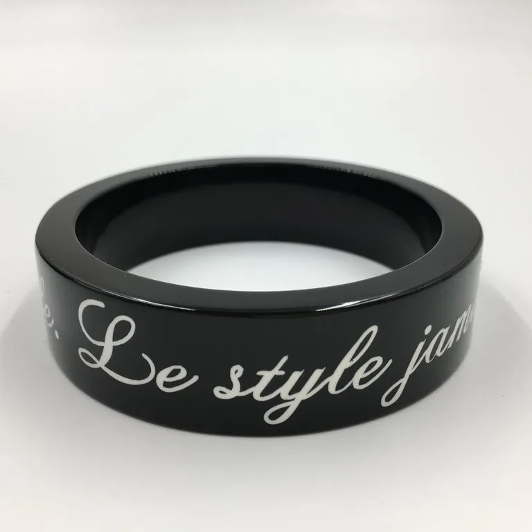 Chanel Black Logo Bangle - La Mode se Demode. Le Style Jamais Coco Chanel