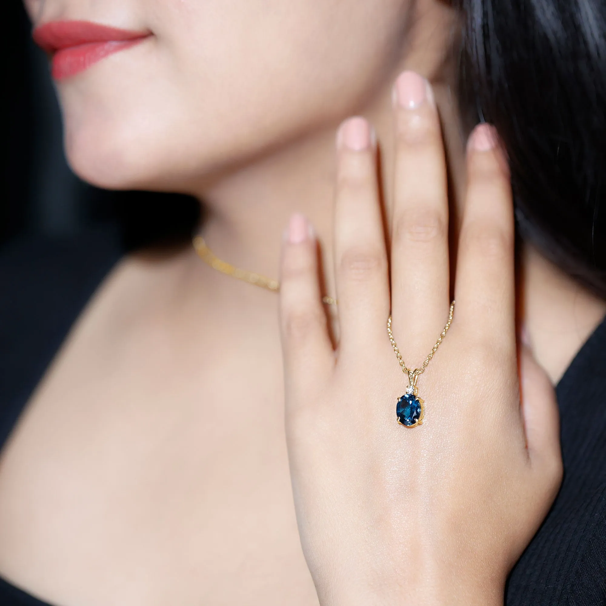 Oval London Blue Topaz Solitaire Pendant with Round Moissanite