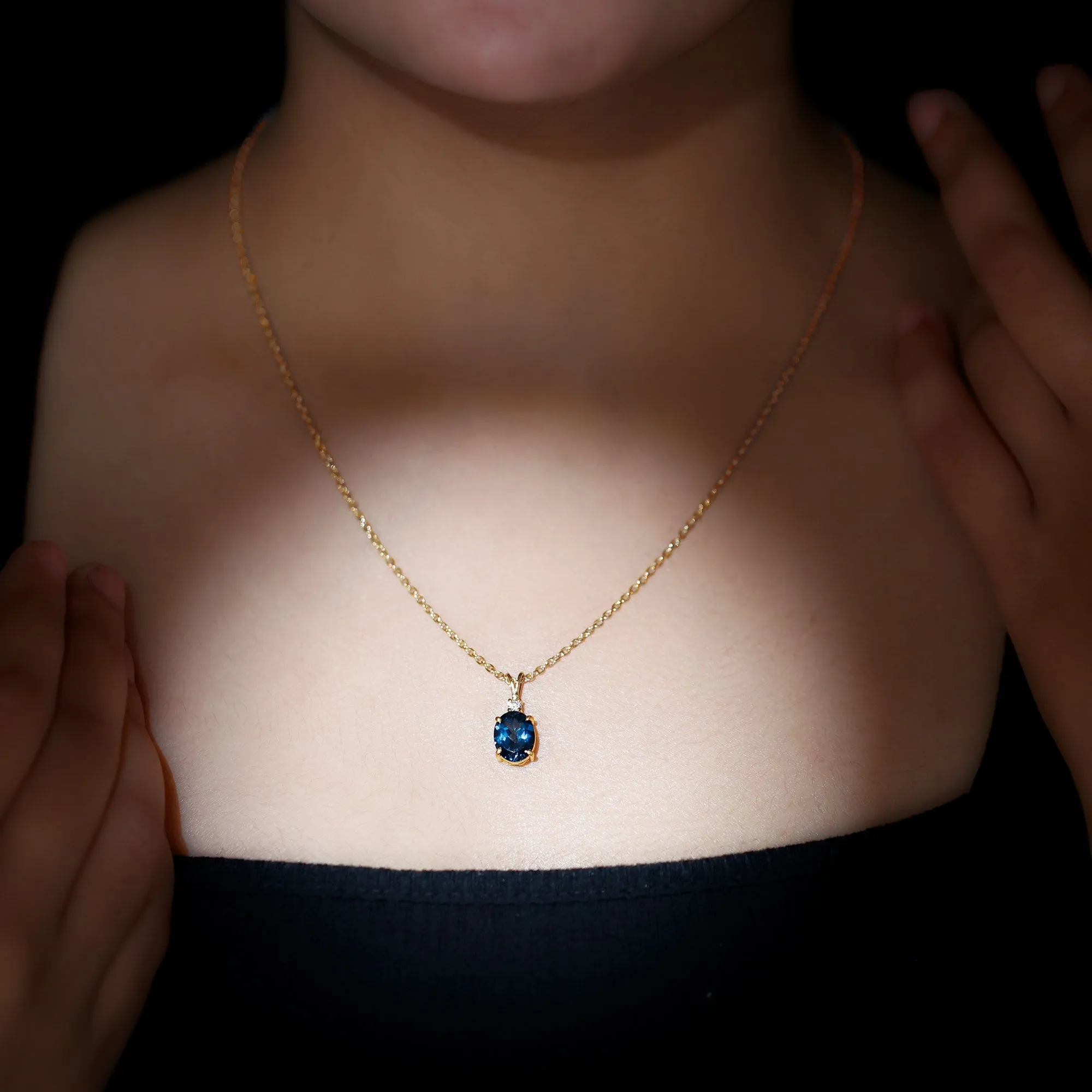 Oval London Blue Topaz Solitaire Pendant with Round Moissanite